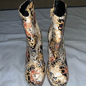 Bamboo brand ankle boots featuring a baroque/chain/pattern with chunky heel.